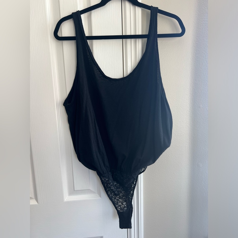 Free people loose for bodysuits with lace trim bottom.